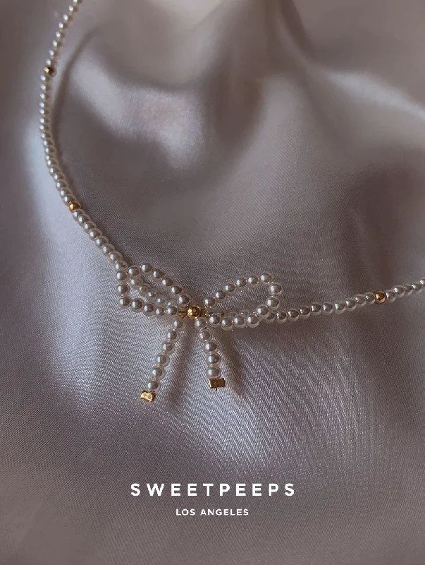 minimalist crystal quartz ring Bridie Pearl Bow Necklace